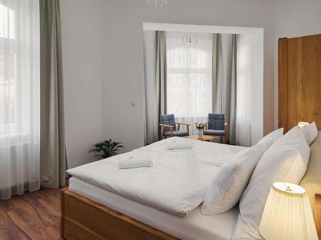 Postel nebo postele na pokoji v ubytování IMPERIAL Apartments