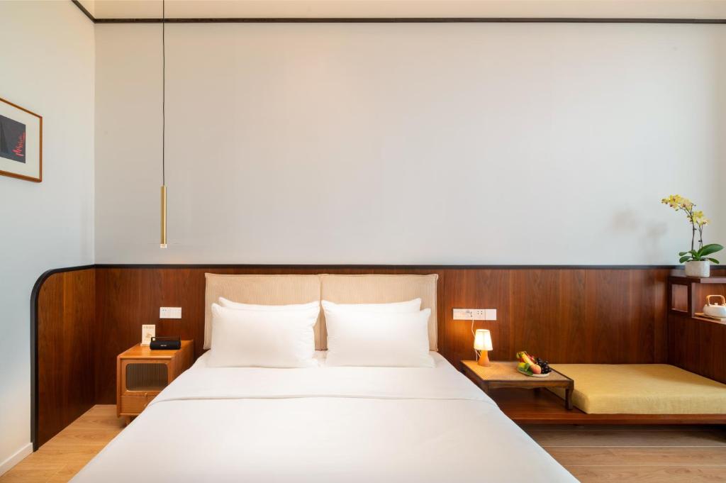Katil atau katil-katil dalam bilik di Wuyu Hotel, Smart Park & Happy Valley Jinshansi Metro
