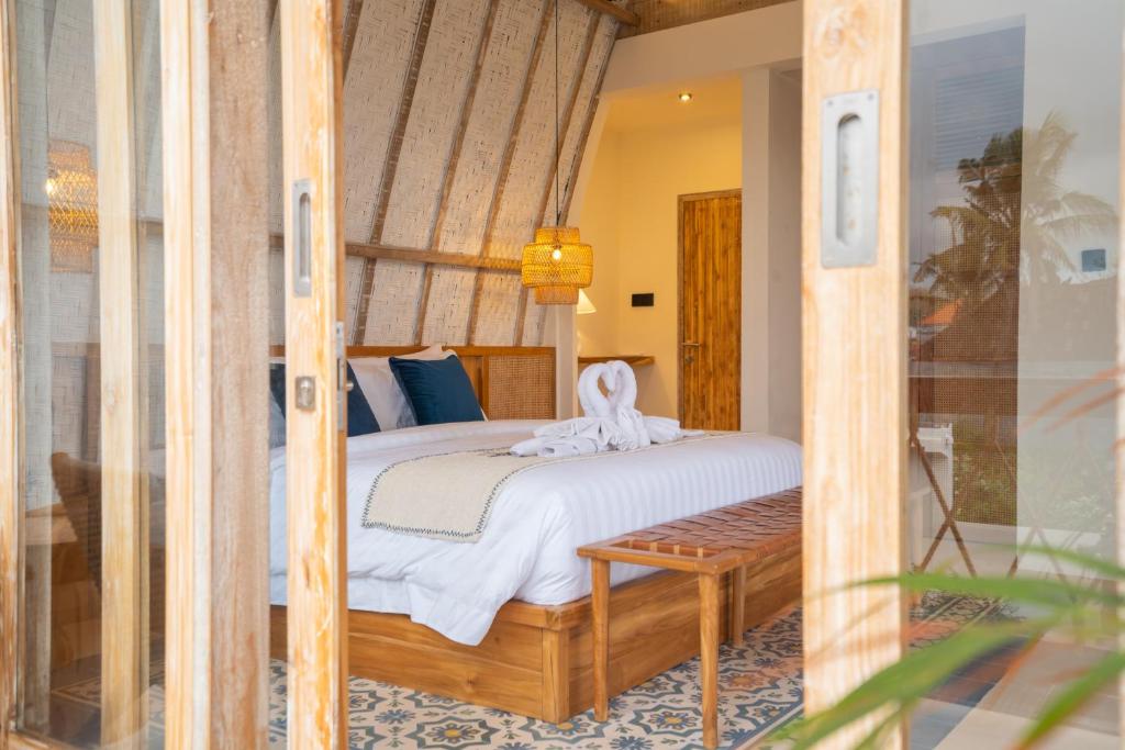 Postel nebo postele na pokoji v ubytování Alana Penida Hotel