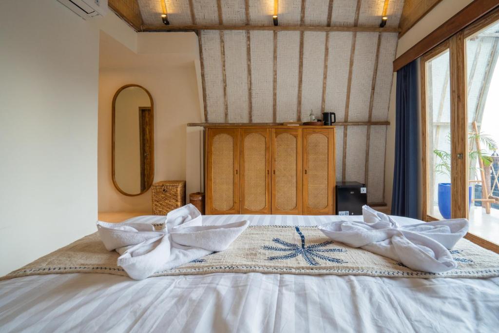 Postel nebo postele na pokoji v ubytování Alana Penida Hotel