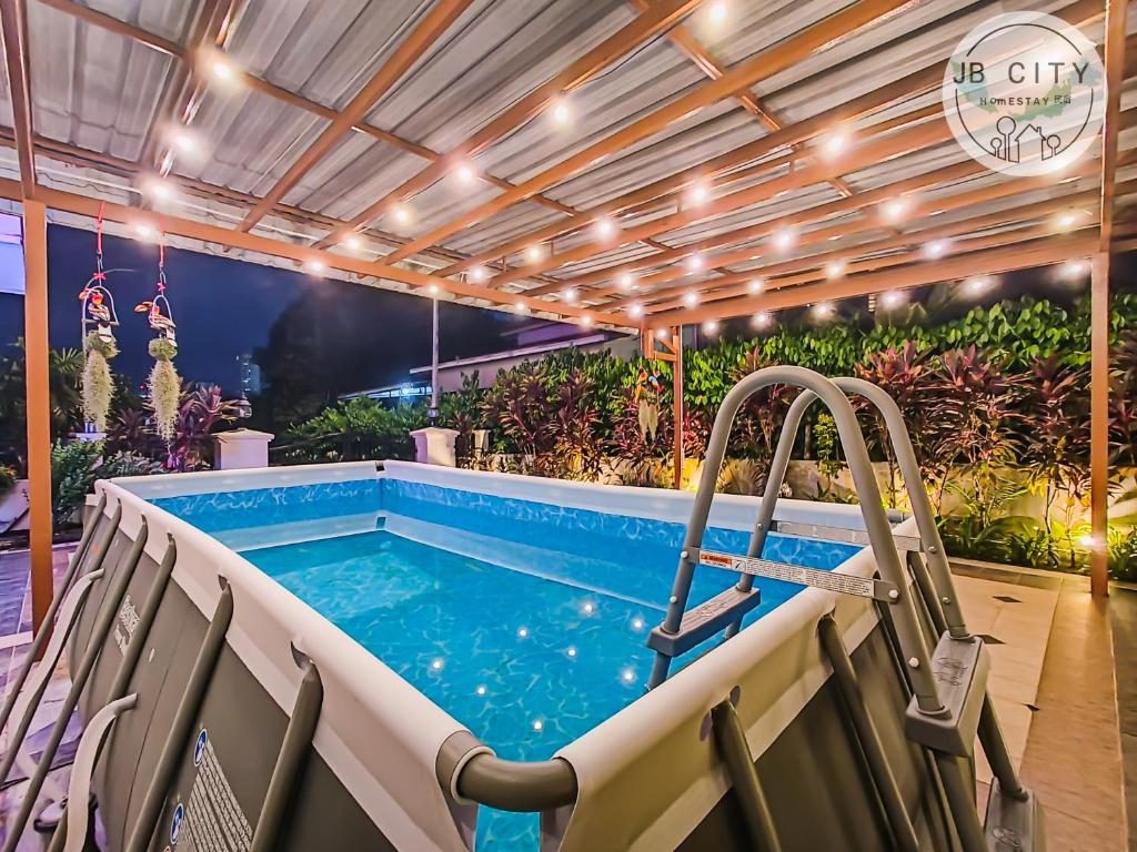 an indoor pool with a hot tub and a slide at JB Town Villa by JBcity Home in Johor Bahru