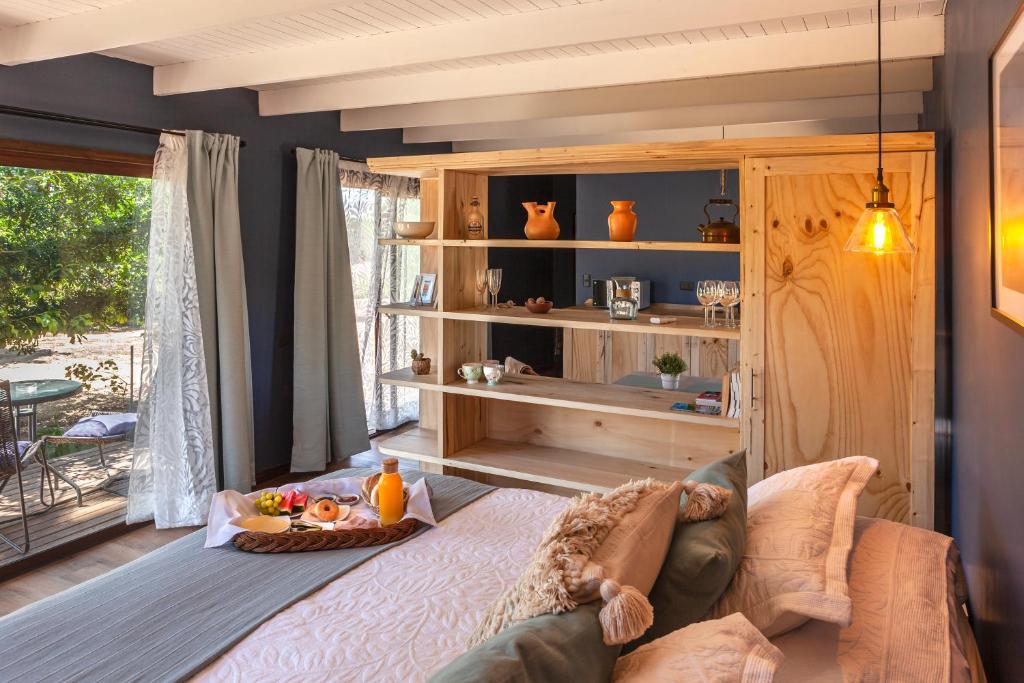 a living room with a couch and a table at Callihue Lodge in Santa Cruz