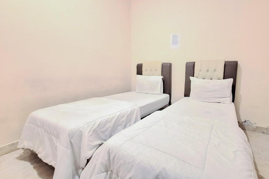 Handira Homestay Syariah Padang RedPartner - Habitación Gemela Estándar