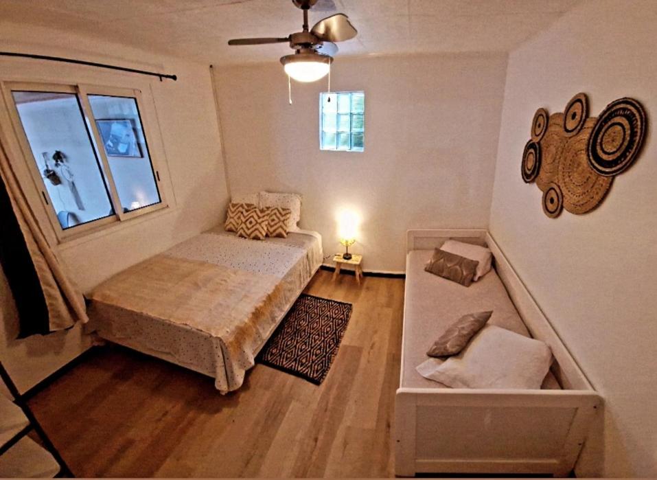 Postel nebo postele na pokoji v ubytování Lilie location sud
