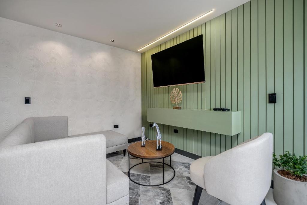 TV a/nebo společenská místnost v ubytování Apartamentos HOUSY Laureles