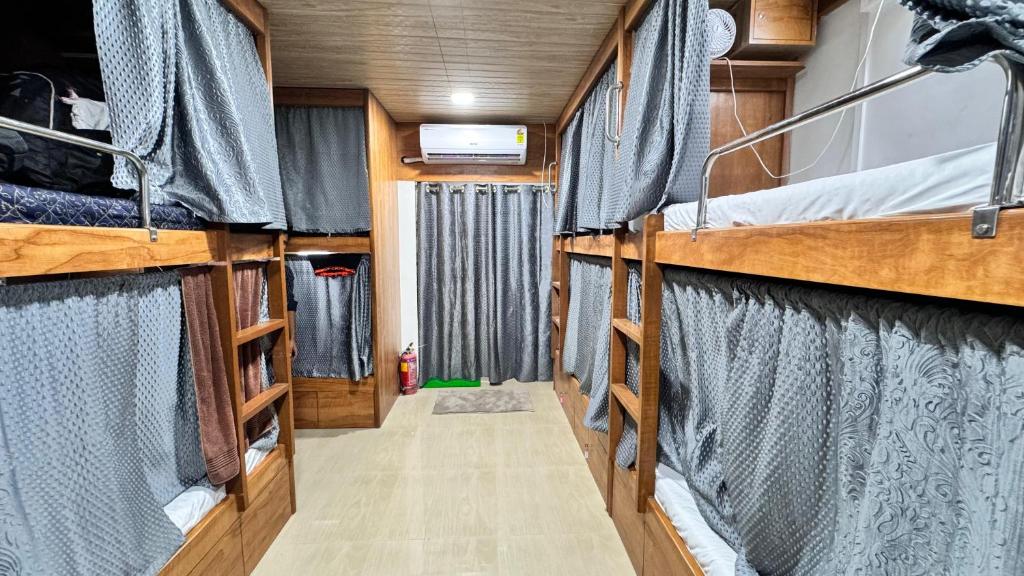 an interior of an rv with two bunk beds at Kailasha - Hostel Cum PG in Mumbai