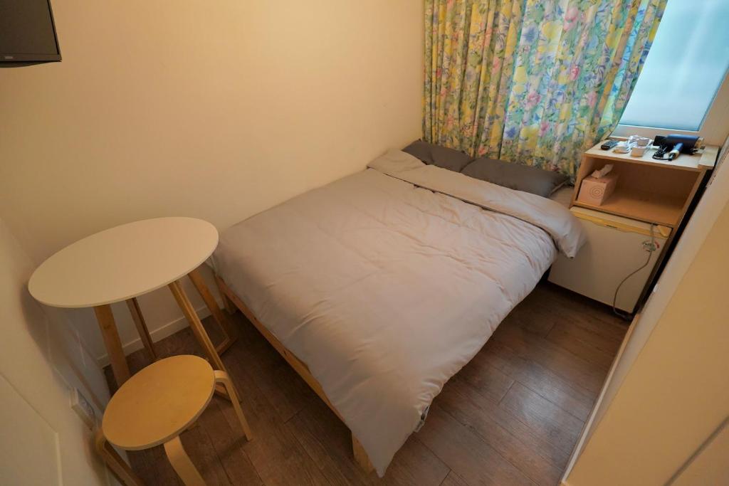 Postel nebo postele na pokoji v ubytování Soo Guest House