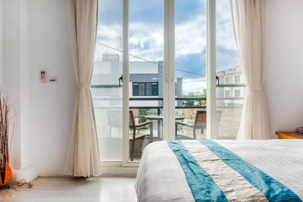 Postel nebo postele na pokoji v ubytování Wei Yuan Hotel