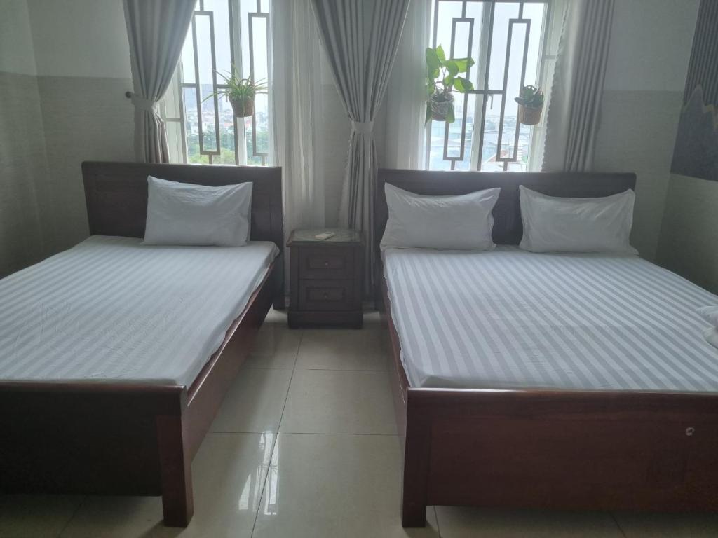 Кровать или кровати в номере Khách sạn Milan