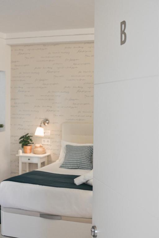 Posteľ alebo postele v izbe v ubytovaní Larios Premium Apartments