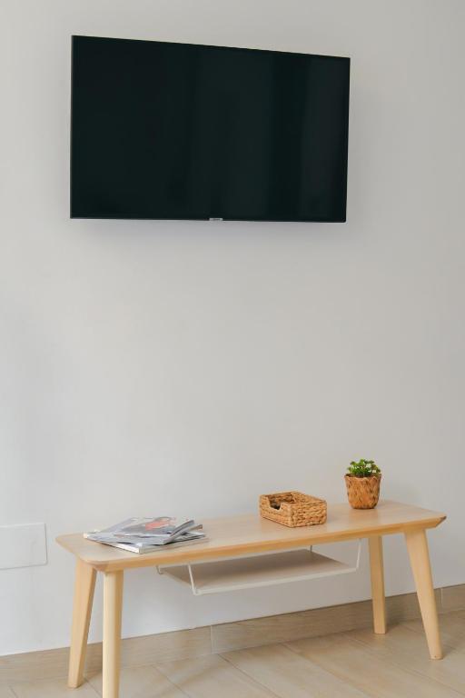 Televízia a/alebo spoločenská miestnosť v ubytovaní Larios Premium Apartments