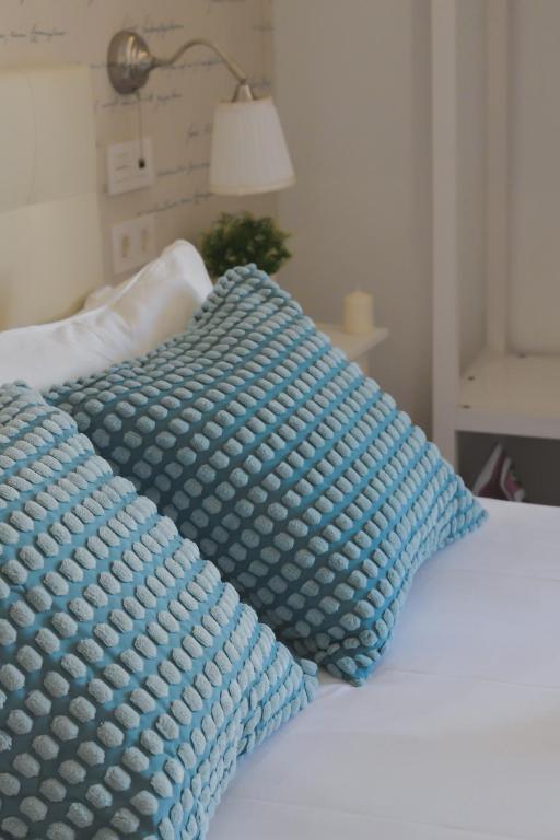 Posteľ alebo postele v izbe v ubytovaní Larios Premium Apartments