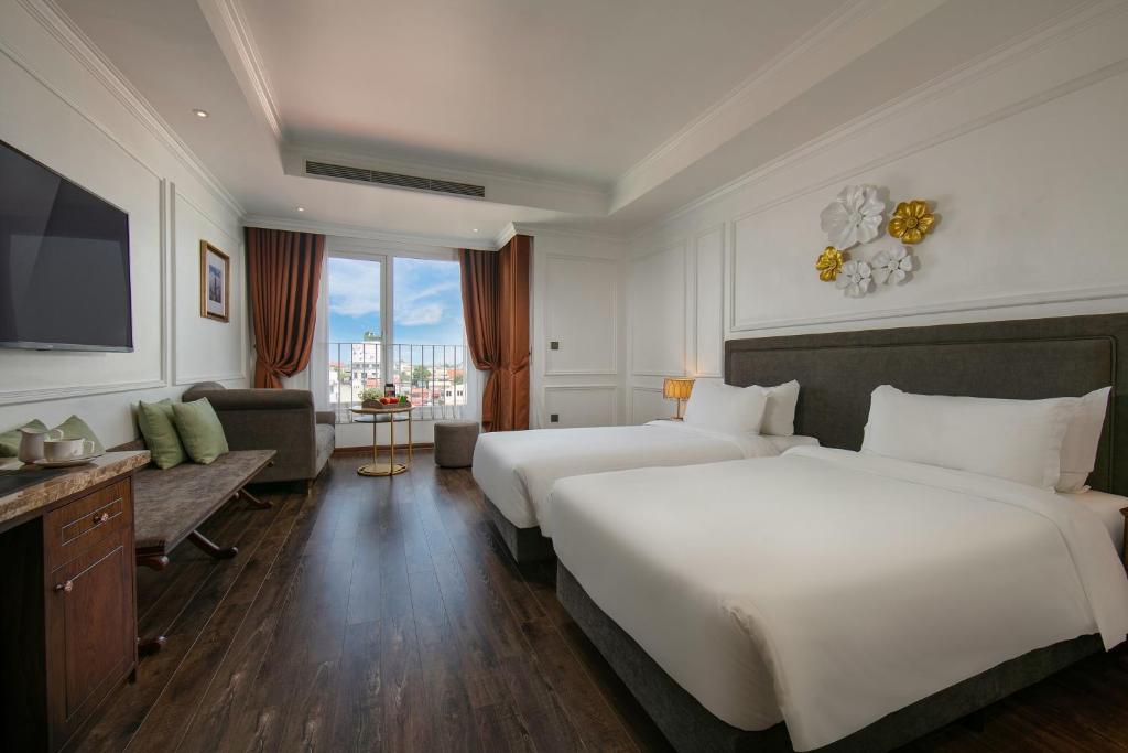 Postel nebo postele na pokoji v ubytování Hanoi Allure Hotel