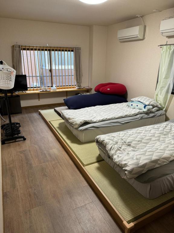 Postel nebo postele na pokoji v ubytování 水之道