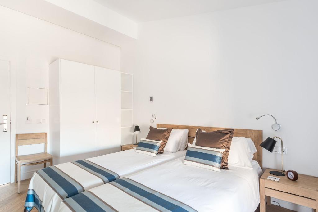 Postel nebo postele na pokoji v ubytování Bordoy Mostatxins - Hotel Boutique Adults Only