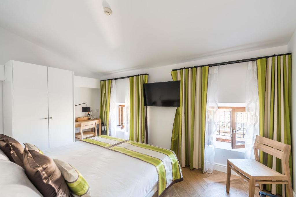 Postel nebo postele na pokoji v ubytování Bordoy Mostatxins - Hotel Boutique Adults Only