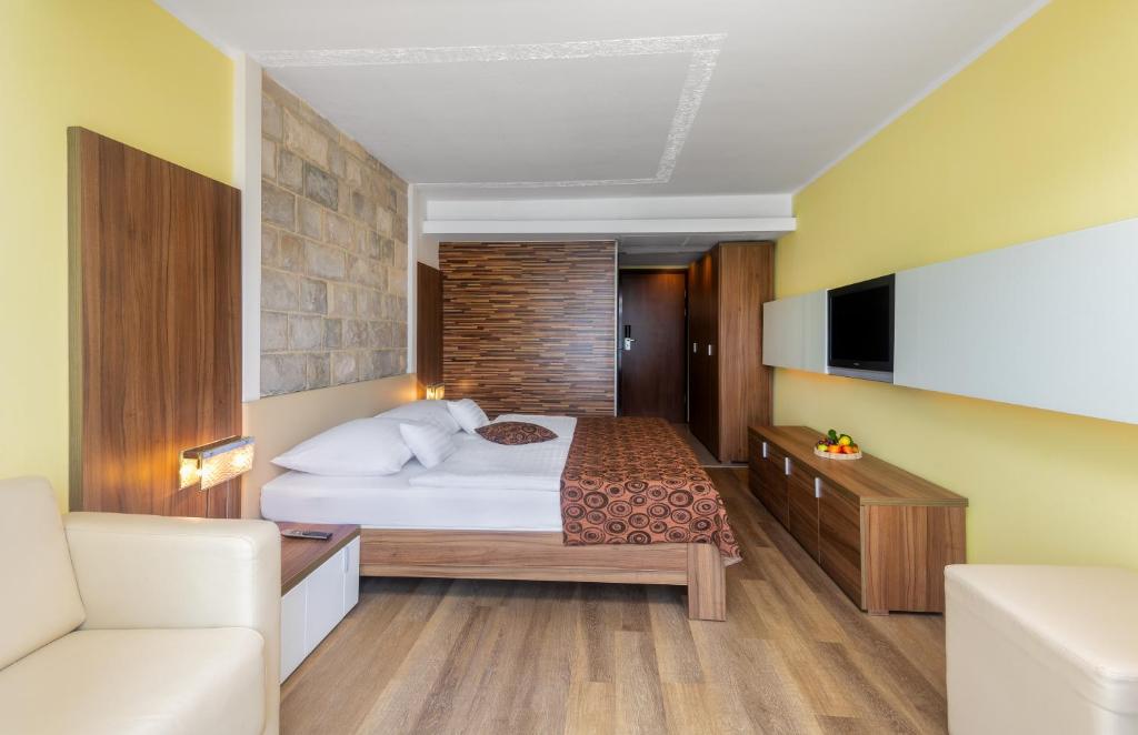 Postel nebo postele na pokoji v ubytování Hunguest Hotel Sun Resort