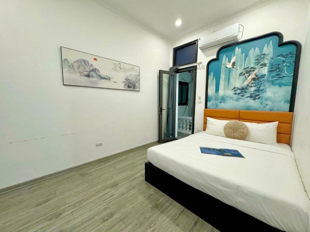 Postel nebo postele na pokoji v ubytování Hanoi Elpis Hotel