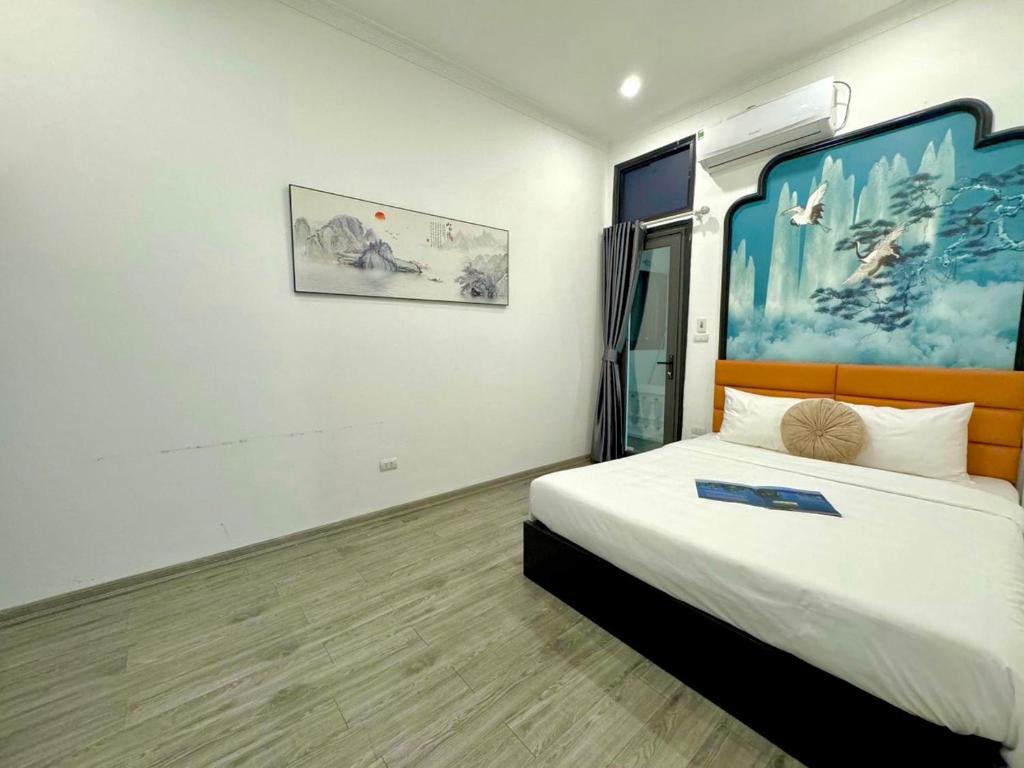 Postel nebo postele na pokoji v ubytování Hanoi Elpis Hotel