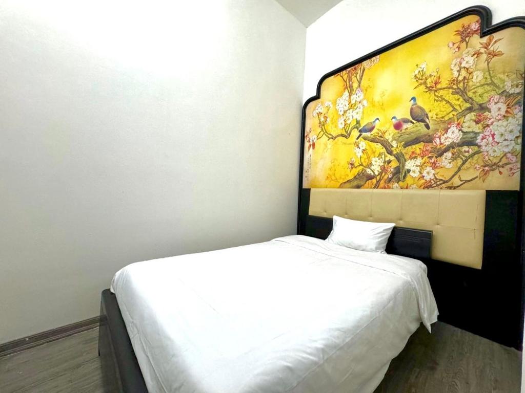 Postel nebo postele na pokoji v ubytování Hanoi Elpis Hotel