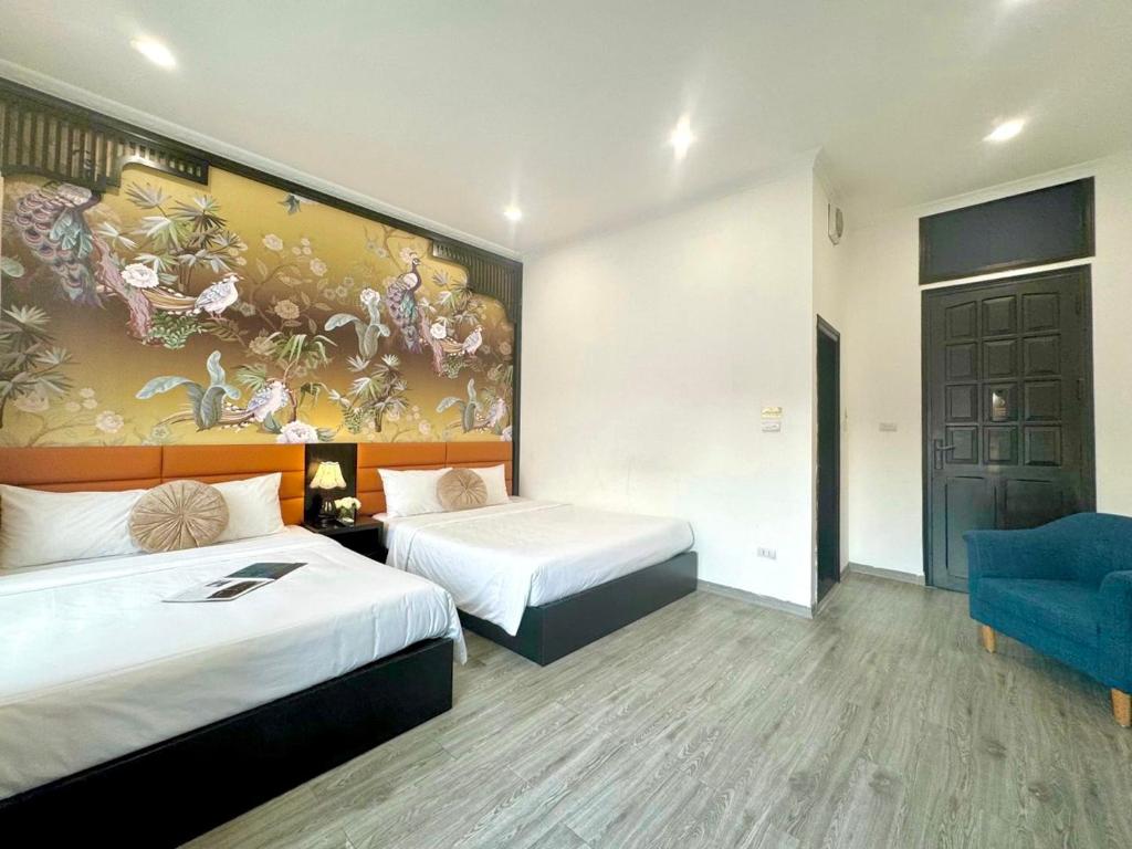 Postel nebo postele na pokoji v ubytování Hanoi Elpis Hotel