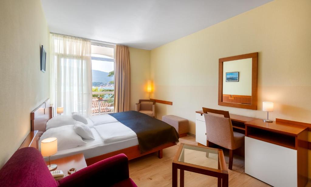 Postel nebo postele na pokoji v ubytování Hunguest Hotel Sun Resort
