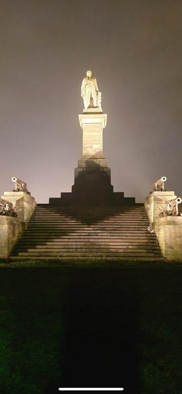 a statue sitting on top of a staircase at Two the Manor Born 3 bedroom house in Tynemouth