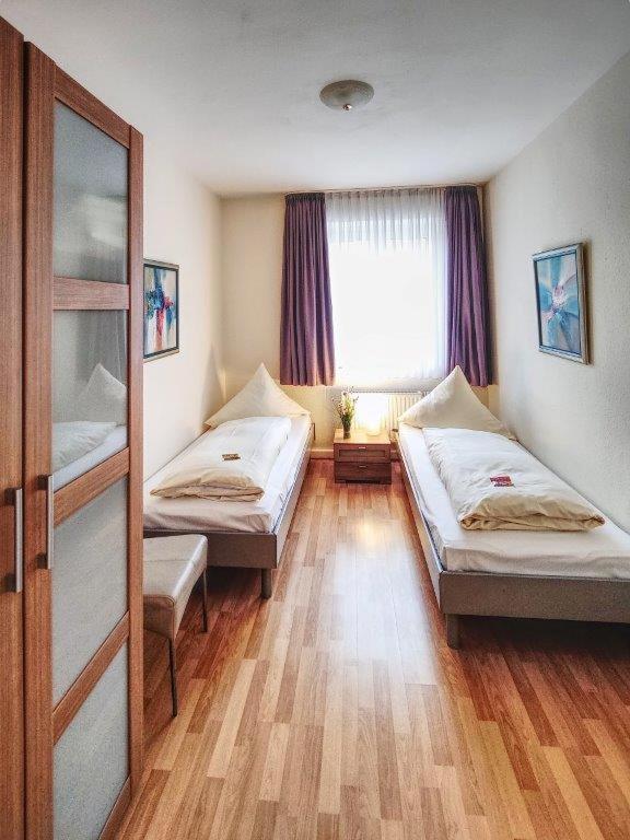 Postel nebo postele na pokoji v ubytování Hotel Lousberg