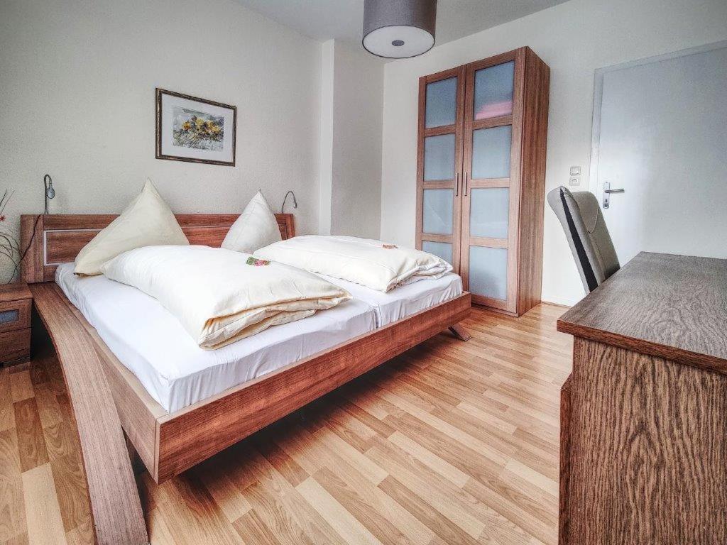 Postel nebo postele na pokoji v ubytování Hotel Lousberg