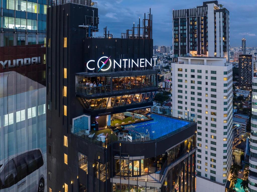 a view of a building with a sign on it at Montraj Continent Sukhumvit Bangkok in Bangkok