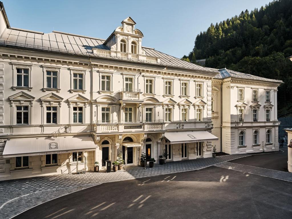 a large building with a tower on top of it at Straubinger Grand Hotel Bad Gastein in Bad Gastein