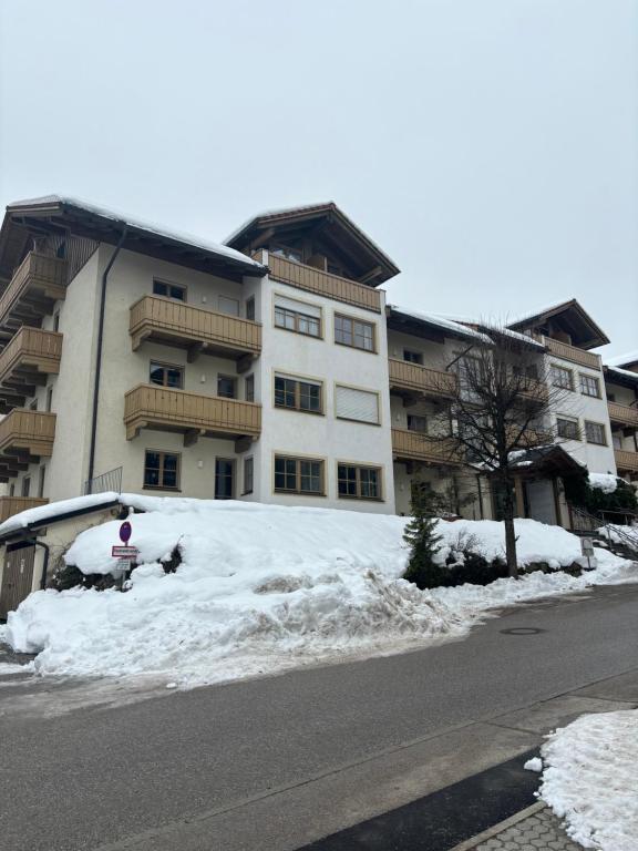a building with a pile of snow in front of it at Sonnenblick in Bad Tölz