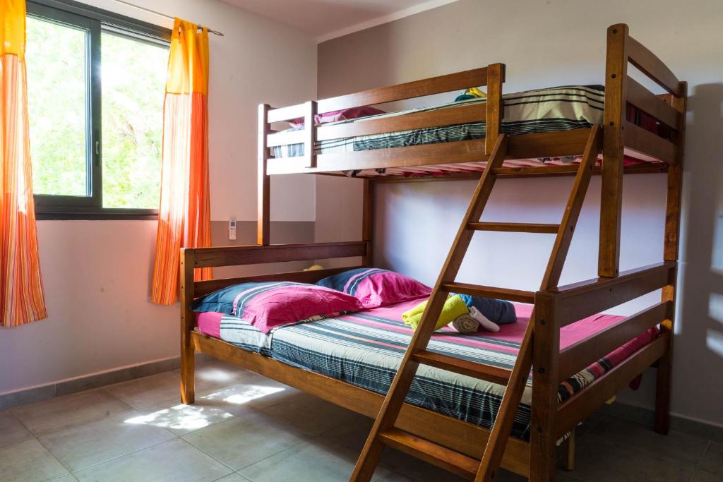 Postel nebo postele na pokoji v ubytování Appart Maïthé 3 Terrasse et proximité lagon