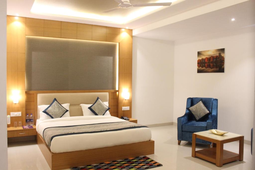 Postel nebo postele na pokoji v ubytování Hotel Transit International- Aerocity Delhi Airport