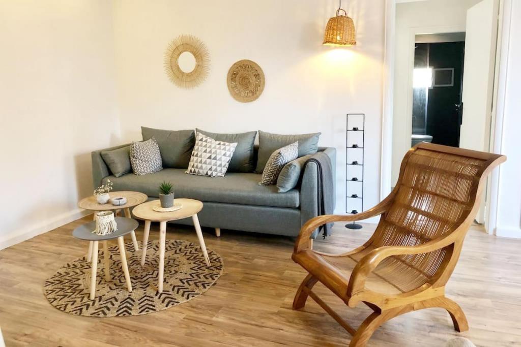 a living room with a couch and a chair at Lovely 2 Bedroom in Gemmayze in Beirut