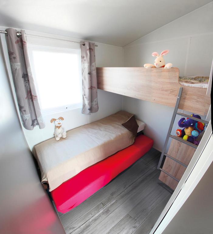 Postel nebo postele na pokoji v ubytování Camping Le Coin Charmant