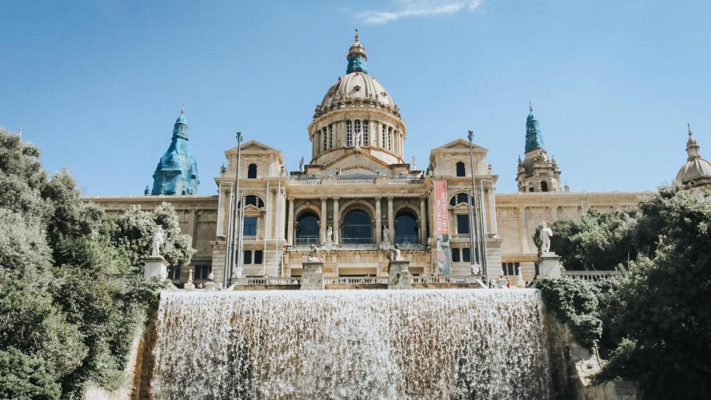 a building with a waterfall in front of it at Hotel Indigo Barcelona Plaza Espana, an IHG Hotel in Barcelona