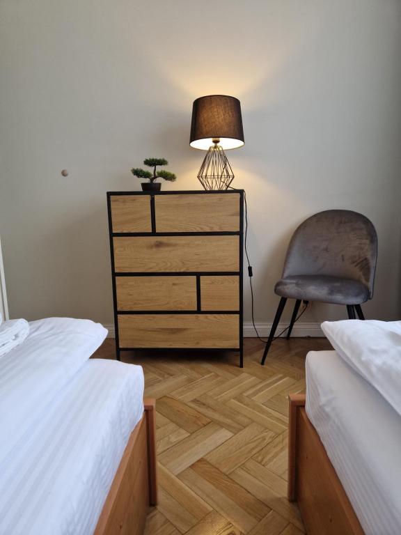 Postel nebo postele na pokoji v ubytování Apartament na Błoniach