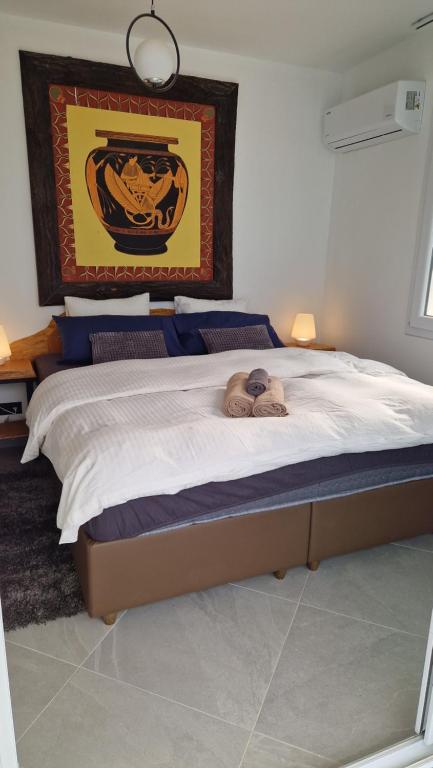 a bedroom with a bed with a stuffed animal on it at Luxury room with panorama seaview in 120 m2 Apartment in Old Town of Kusadasi in Kusadası