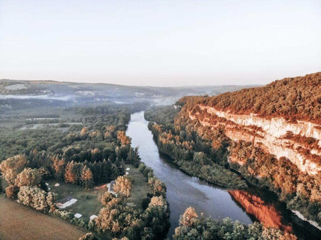 an aerial view of a river in a canyon at Lodg'ing Nature Camp Dordogne in Lacave