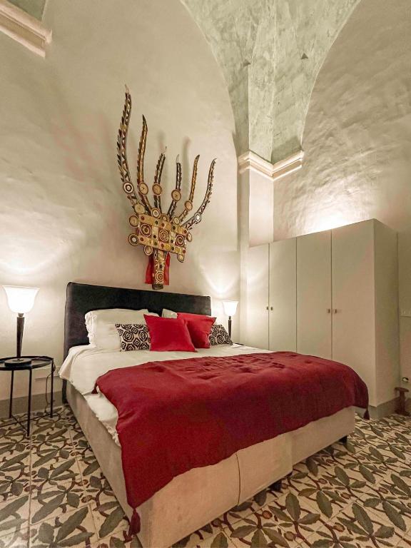 Postel nebo postele na pokoji v ubytování Palazzo Saetta