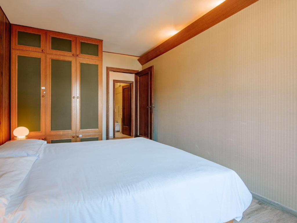 Posteľ alebo postele v izbe v ubytovaní Apartment Condominio al Parco-9 by Interhome