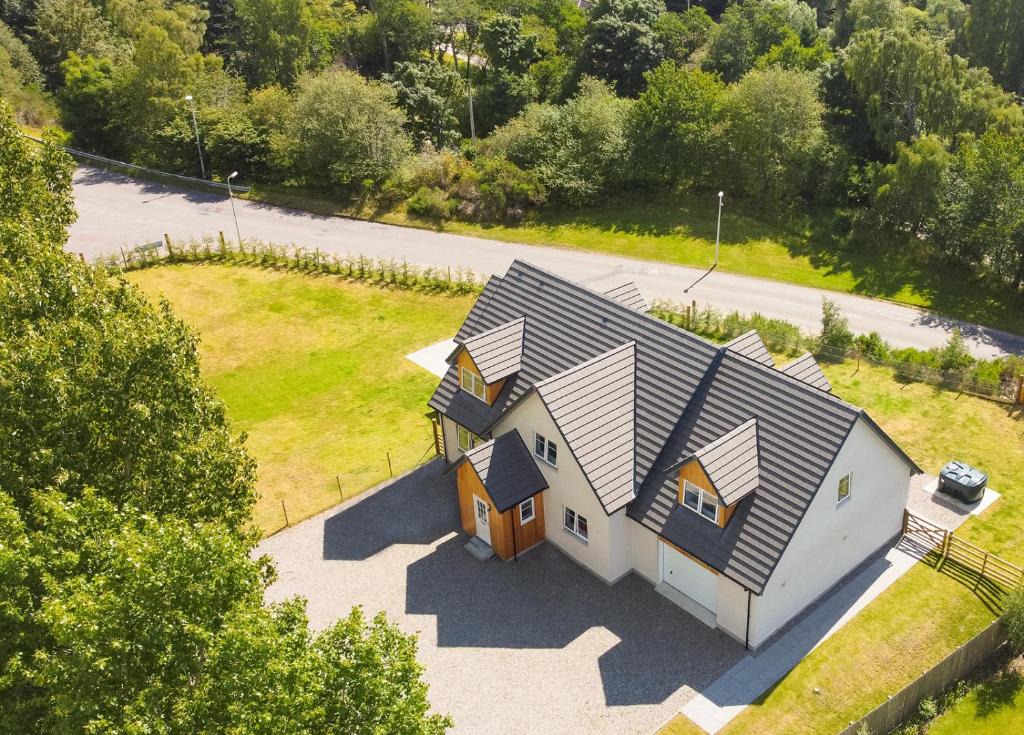 an overhead view of a house with a roof at Braeside - Family home in Nethy Bridge in Nethy Bridge
