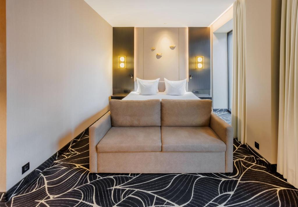 Voodi või voodid majutusasutuse Movenpick Hotel Tallinn toas