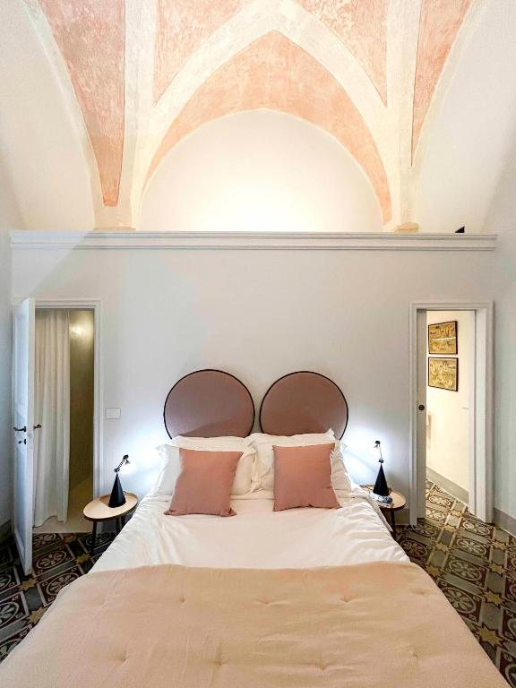 Postel nebo postele na pokoji v ubytování Palazzo Saetta