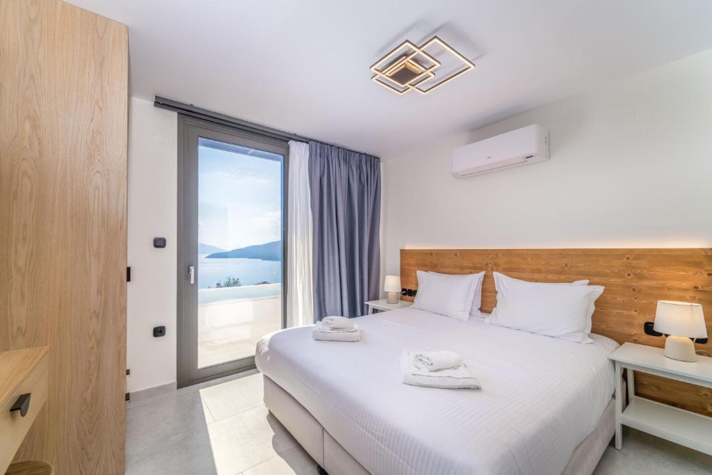 Ένα ή περισσότερα κρεβάτια σε δωμάτιο στο Smirties Villas
