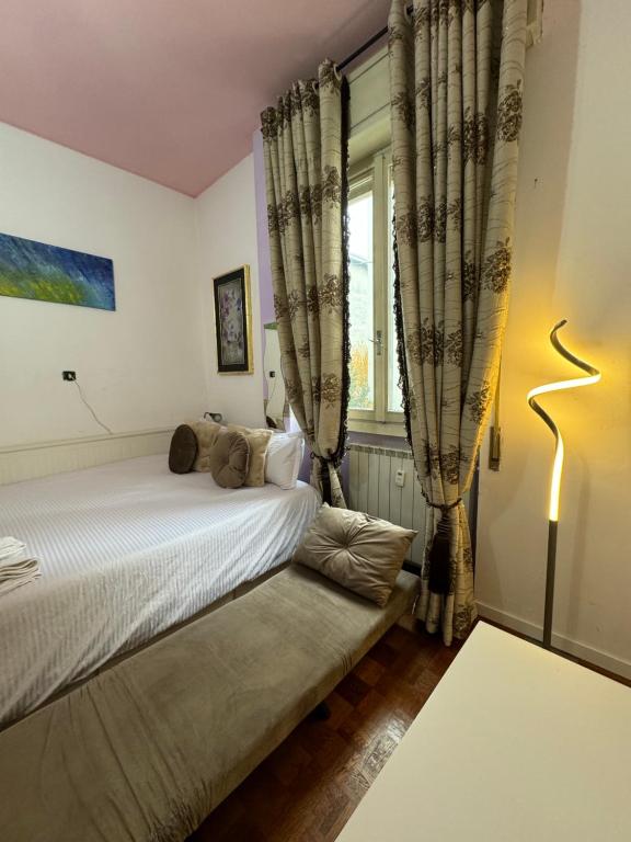 Postel nebo postele na pokoji v ubytování Fenice