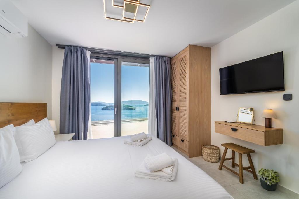 Ένα ή περισσότερα κρεβάτια σε δωμάτιο στο Smirties Villas