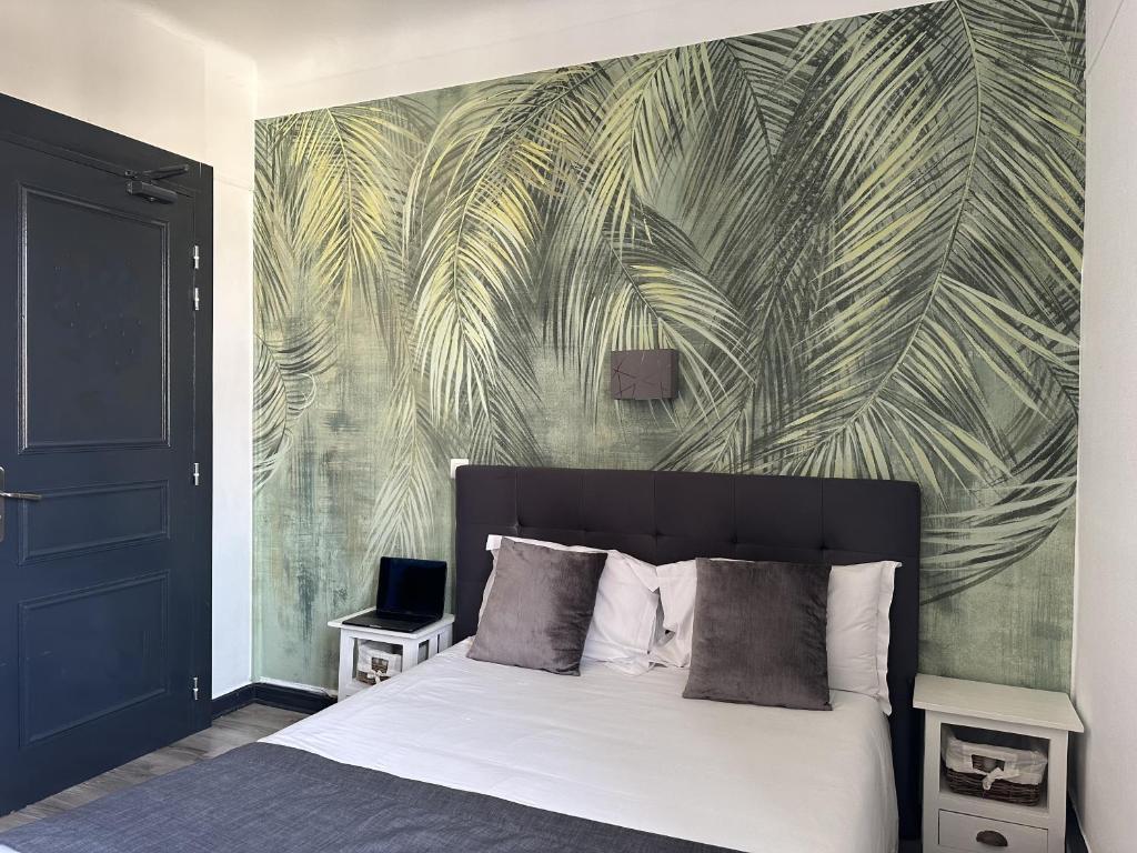 Postel nebo postele na pokoji v ubytování Hôtel Parc Mazon-Biarritz