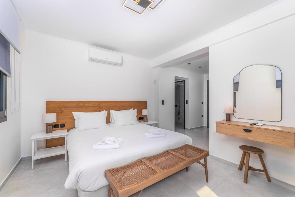 Ένα ή περισσότερα κρεβάτια σε δωμάτιο στο Smirties Villas